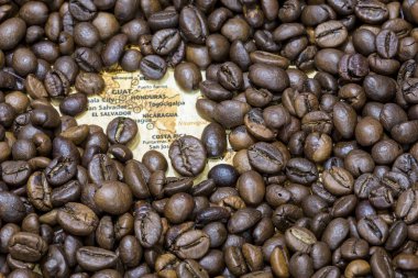 Map of Central America under a background of coffee beans clipart