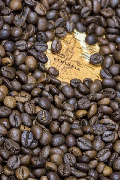 Map of Ethiopia under a background of coffee beans — Stockfoto