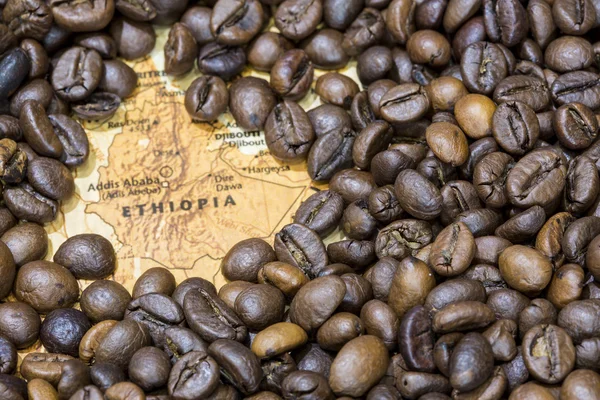 Map of Ethiopia under a background of coffee beans