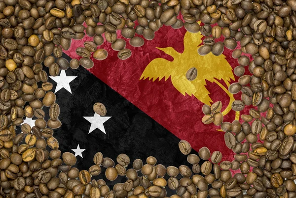 Flag of Papua New Guinea under a roasted coffee beans background texture — Stock Photo, Image
