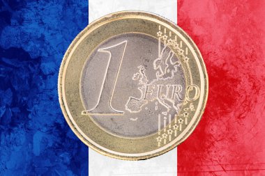 One euro coin on the flag of France as background clipart