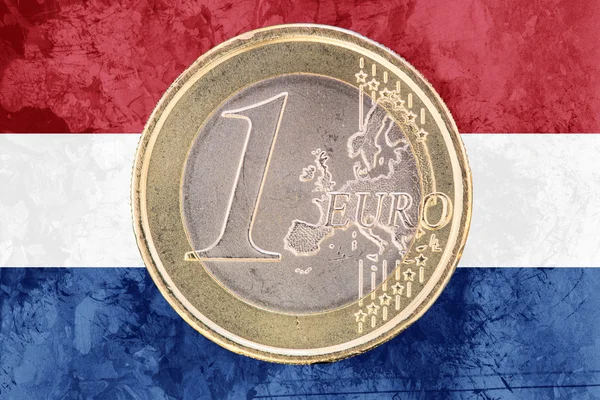 One euro coin on the flag of Netherlands as background — Stockfoto