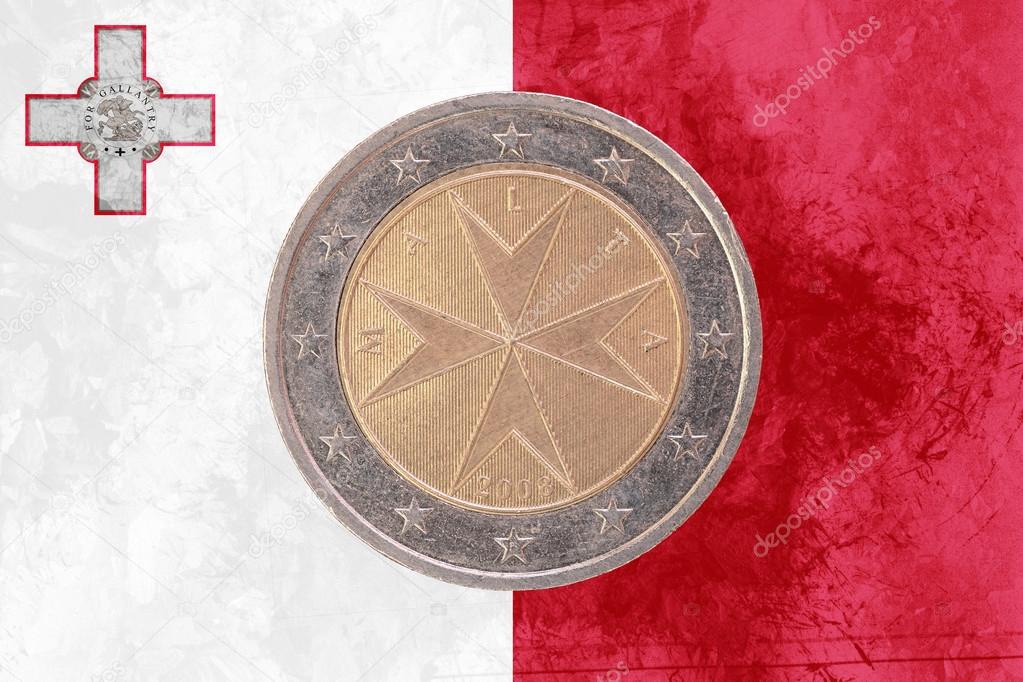 Maltese two euros coin with flag of Malta as background