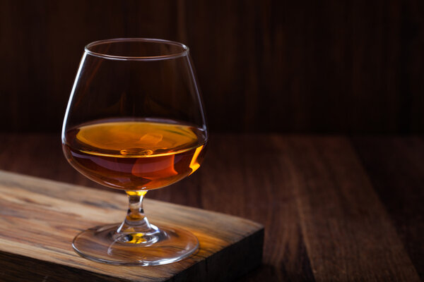 cognac on a wooden background