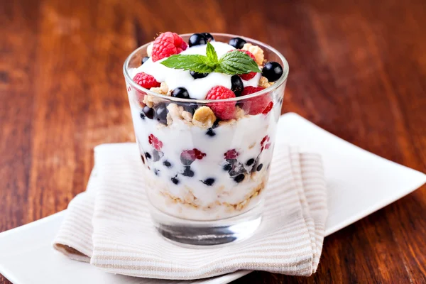 Yogurt with muesli and berries — Stock Photo, Image