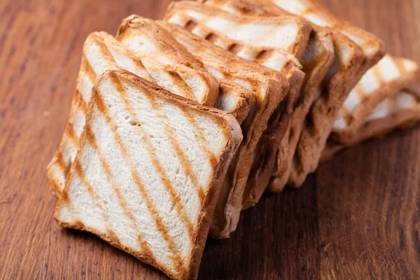 Geroosterd brood, op een houten — Stockfoto