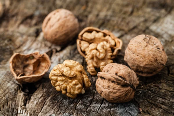 Walnuts isolated on a wooden table — Stock Photo, Image