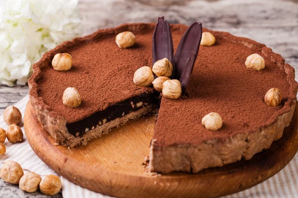 Chocolate tart with hazelnuts — Stock Photo, Image