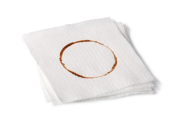 Paper Napkin with a coffee stain isolated on white background — Stock Photo, Image