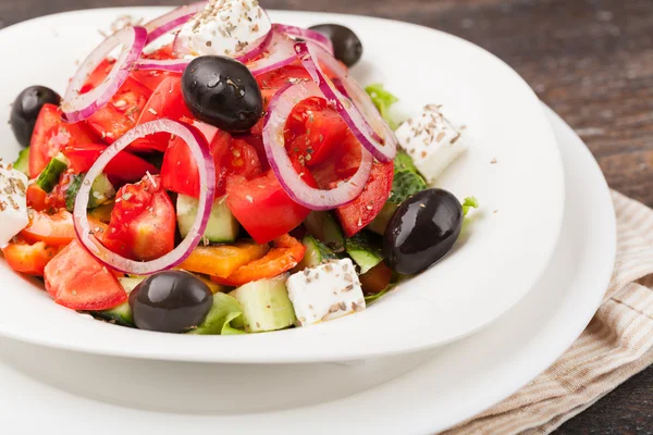 Fresh Greek salad in a plate — Stock Photo, Image