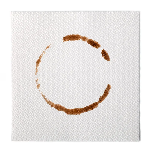 Paper Napkin with a coffee stain isolated on white background — Stock Photo, Image