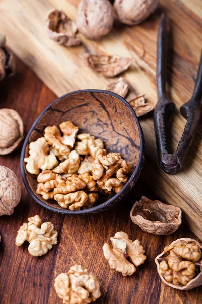 Walnuts isolated on a wooden table — Stock Photo, Image