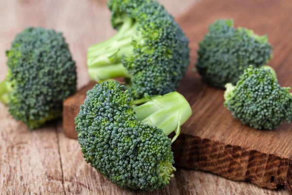 Fresh broccoli on a wooden table — Stock Photo, Image