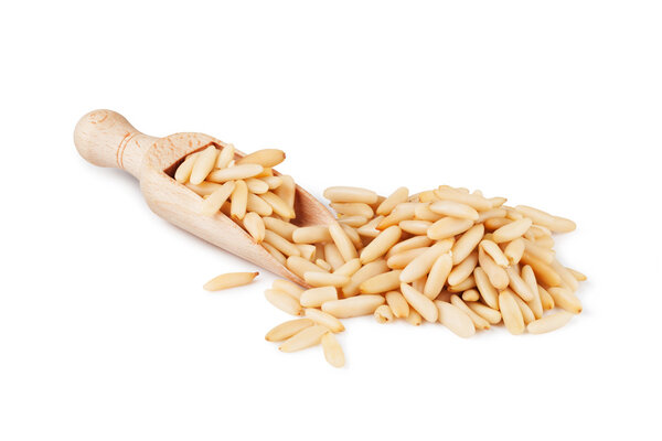 wooden scoop with pine nuts