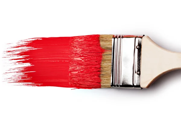 Målarborste med röd färg — Stockfoto