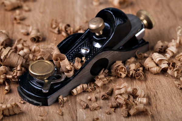 Wooden plane and shaving — Stock Photo, Image