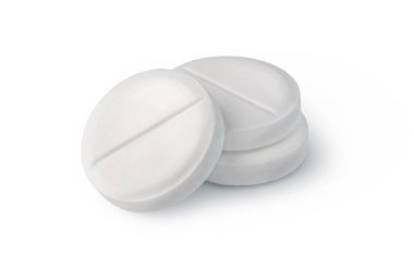 Beyaz yuvarlak tabletler beyaz bir yüzeye yığılmış bir sayı çizgisi ile