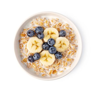 Taze muz dilimli mısır gevreği ve beyaz arka planda izole edilmiş yaban mersini.