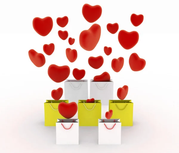 Hearts falling into gift bags — Stock Photo, Image