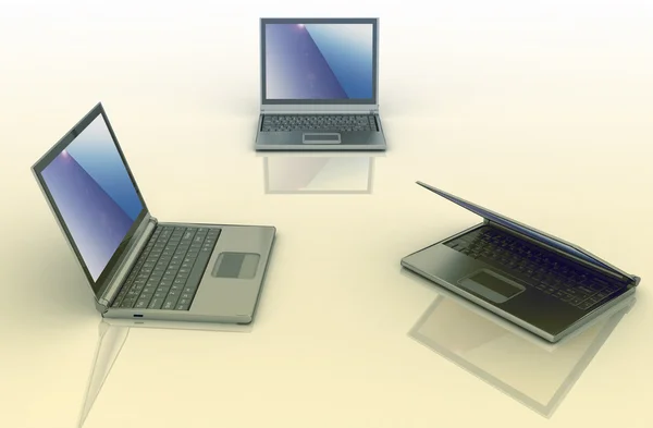 Trzech laptopów na białym tle nad kolorowym tle — Zdjęcie stockowe