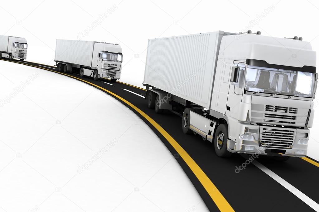 White Trucks on freeway. Concept of logistics, delivery and transporting by freight motor transport.