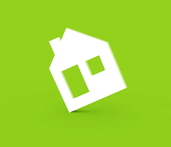 Символ трехмерного дома на зеленом фоне — стоковое фото