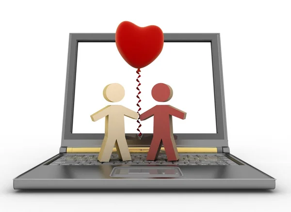 Couple with a balloon in the form of heart on laptop — Stock Photo, Image