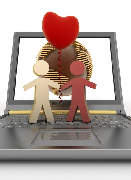 Couple with a balloon in the form of heart on laptop — Stock Photo, Image