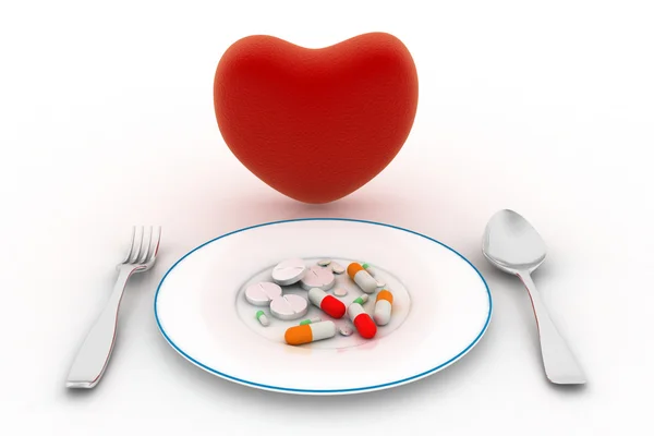 Heart and pills on the plate — Stock Photo, Image