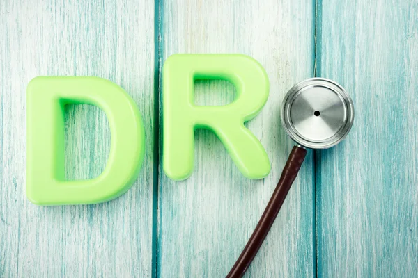 Close-up of two letters DR and stethoscope — Stock Photo, Image