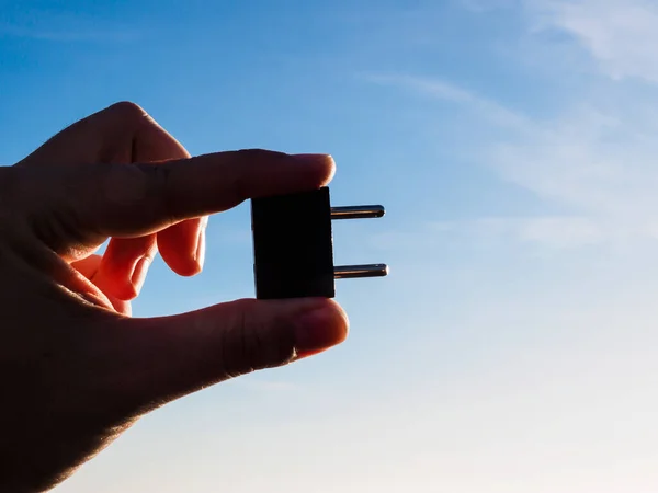 Man Holding Black Plug — Stock Photo, Image