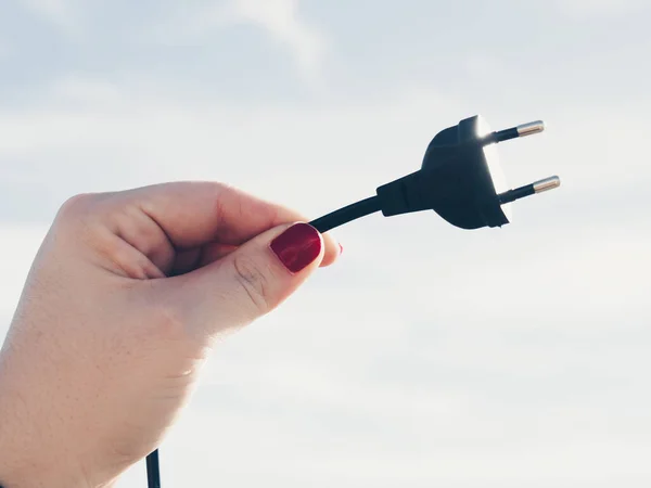 Woman Holding Black Plug — Stock Photo, Image