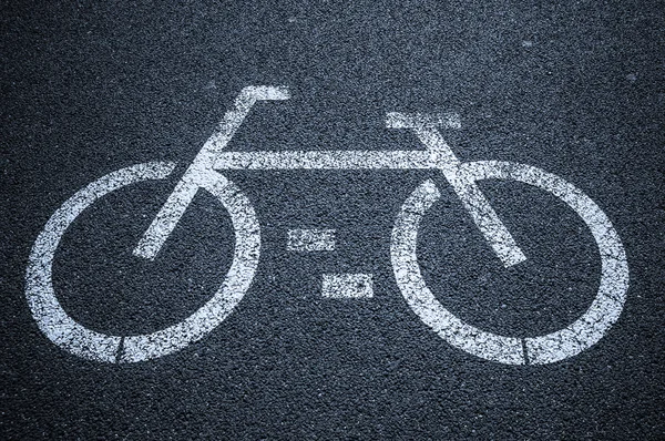 Bicycle road sign on asphalt — Stock Photo, Image