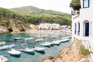 COSTA BRAVA, SPAIN - JULY 19: : Tourists relax on July 19, 2014  clipart
