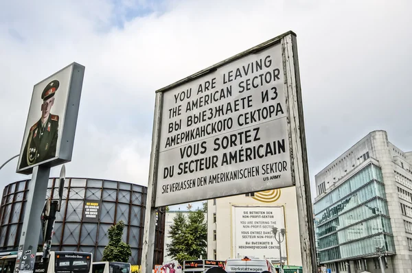 BERLIN, GERMANY - SEPTEMBER 21:   Checkpoint Charlie on September 21, 2013 in Berlin, Germany. It's the best-known Berlin Wall crossing point between East and West Berlin during the Cold War.