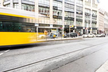BERLIN, GERMANY - SEPTEMBER 18: typical yellow tram on September 18, 2013 in Berlin, Germany. The tram in Berlin is one of the oldest tram systems in the world.
