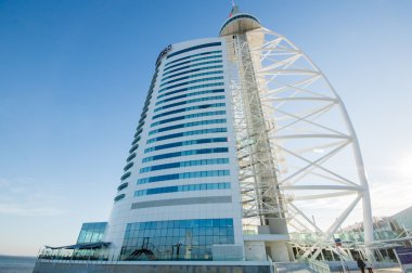  LISBOA, PORTUGAL - NOVEMBER 30: Vasco da Gama Tower in the Park of the Nations on November 30, 2013 in Lisbon, Portugal.  It is a 145 meters skyscraper built over the Tagus river.