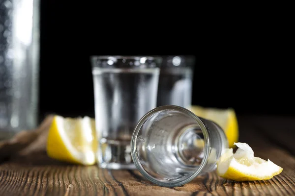 Pure Vodka on an old wooden table — Stock Photo, Image