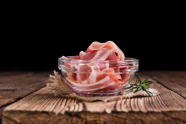 Bacon on wooden table — Stock Photo, Image