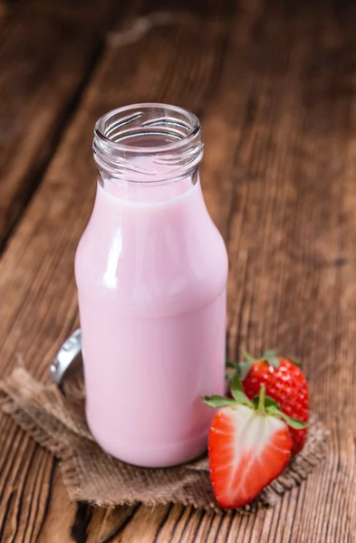 Milk on wooden table — Stock Photo, Image