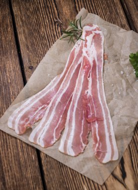 Bacon on wooden table clipart