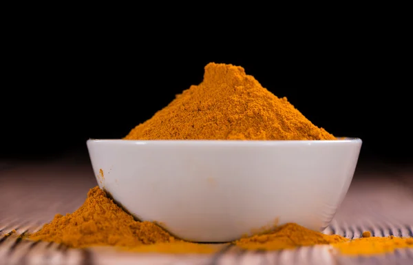 An old wooden table with Turmeric — Stock Photo, Image