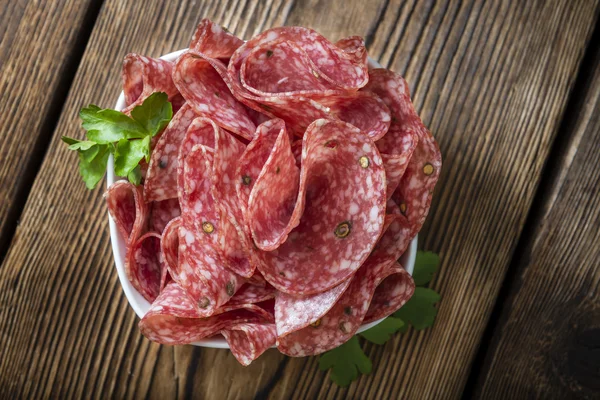 Slices Salami on table — Stock Photo, Image