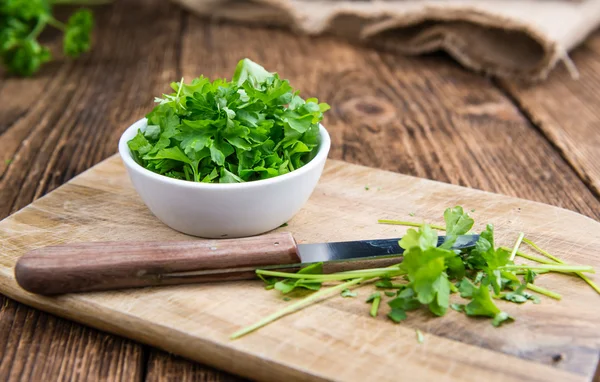 Parsley on wooden background — Stock Photo, Image