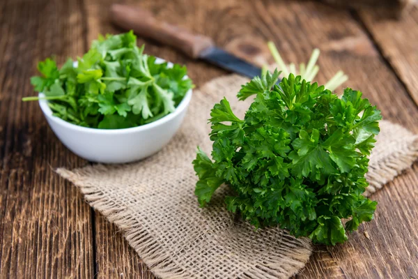 Parsley on wooden background — Stock Photo, Image