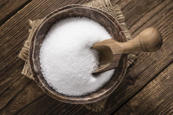 Beyaz şeker ile eski ahşap masa — Stok fotoğraf