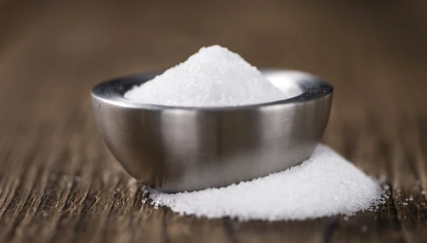 Bílý cukr na stole — Stock fotografie