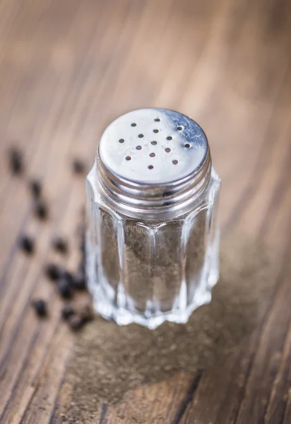 Pepper Shaker on vintage table — Stock Photo, Image