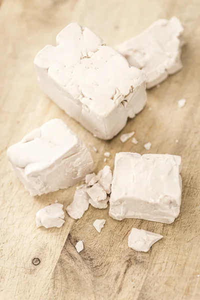 Heap of Yeast on table — Stock Photo, Image