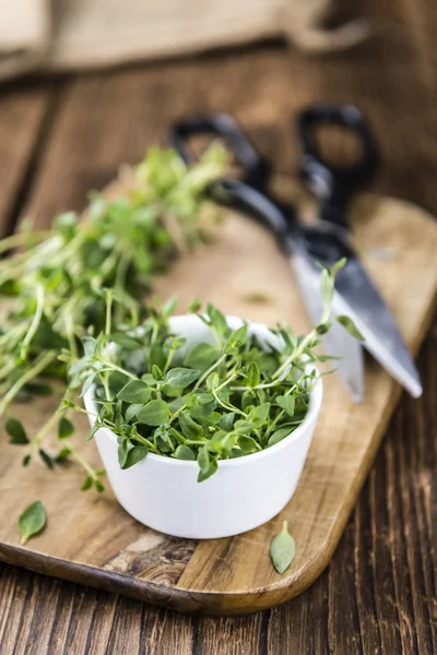 Thyme on wooden table — Stock Photo, Image